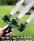Heavy Duty Three Way Garden Hose Splitter With Shutoff Valve No Fuss And Three Quarter Inch GHT Threads Durable ABS With Metal Inlets And Outlets T Adapter Connector Outdoor Faucet Splitter Leak Free Easy To Use Green attached to hose, spraying three streams