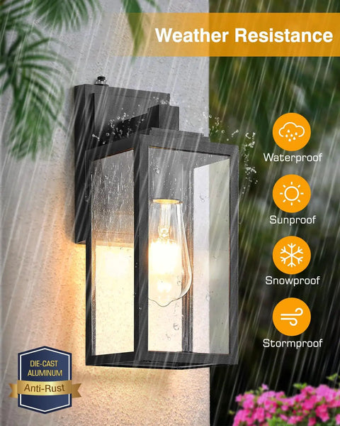Two Pack Dusk-To-Dawn Sensor Outdoor Wall Light Fixture in rain, black sconce with anti-rust aluminum and seeded glass.