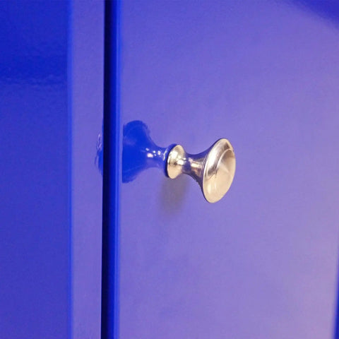 Close-up of blue drawer handle on Rolling Tool Cart With Five Drawers On Wheels Heavy Duty Steel Tool Chest For Garage And Warehouse Storage Blue Mobile Tool Box Organizer Durable Construction With Easy Glide Casters For Heavy Tools And Ample Storage In Workshops And Garages
