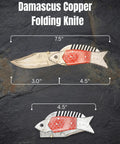 Damascus Steel Folding Knife With Ladder Pattern Blade And Copper Fish Style Handle open and closed view on rock surface