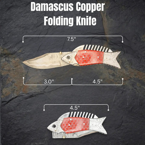 Damascus Steel Folding Knife With Ladder Pattern Blade And Copper Fish Style Handle open and closed view on rock surface