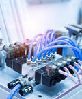 Industrial pneumatic setup with multiple blue air tubes and connectors, showcasing push to connect air fittings for efficient connections.