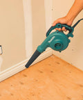 Person using Two In One Blower Vacuum With 145 CFM Air Volume And 203 MPH Air Speed Variable Speed Dial And Trigger for cleanup
