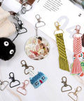 80 Pack Hella Durable Swivel Clasp Hooks Key Chain Clips With Secure D Ring Lanyard Hardware Solid Zinc Alloy Keychain Findings assorted colors displayed with crafts.