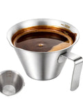 Stainless Steel Espresso Cup With Handle, Durable Coffee Shot Measuring Cup With Built-In Scale, V Shaped Mouth, 3.4 Oz 100 Ml, Rust-Resistant, Dishwasher Safe, Easy Pour For Your Home Barista Setup filled with espresso.