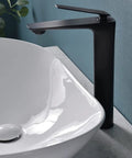 Close-up of Large Oval Vessel Sink 24 Inch By 13.8 Inch White Ceramic Above Counter Bathroom Sink With Pop Up Drain beside faucet