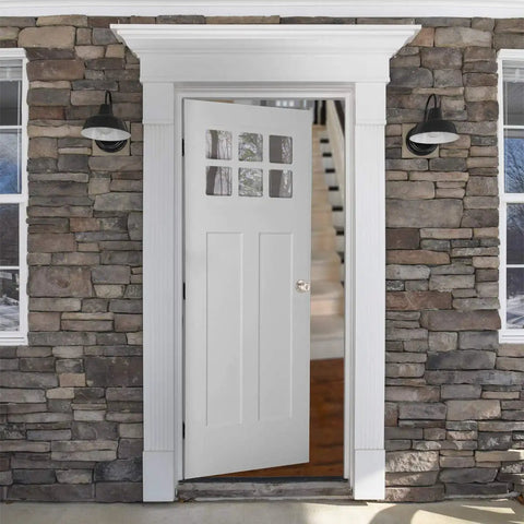 Open stone-framed entryway with white door partially open, showcasing exterior door knob with lock in satin nickel finish.