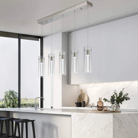 Modern Five Light LED Pendant Ceiling Fixture With Brushed Nickel Bubble Cylinder in a sleek kitchen setting