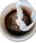 Heavy Duty Cold Brew Coffee Filter Bags 100 Pack No Fuss Disposable Brewing Sacks with secure drawstring in brewing bucket.