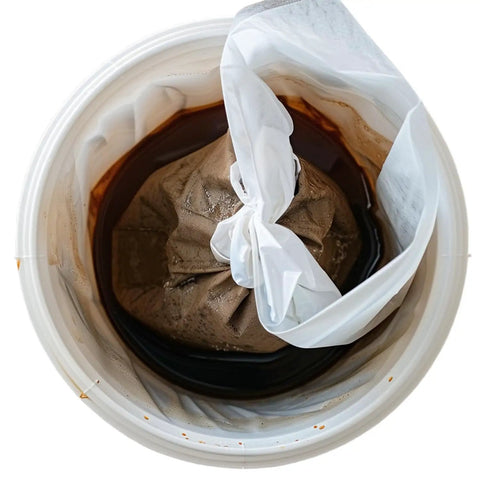 Heavy Duty Cold Brew Coffee Filter Bags 100 Pack No Fuss Disposable Brewing Sacks with secure drawstring in brewing bucket.