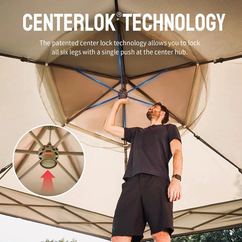 Man setting up 13 By 13 Pop Up Gazebo With Mosquito Netting Centerlok Six Sided Portable Canopy using center lock technology