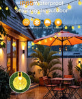 64ft 100 LED Crystal Globe Solar String Lights outdoor waterproof with 8 lighting modes on patio during rain.