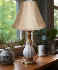 Gold Bell Lamp Shades Set Of 2 For Table Lamps Traditional Linen Spider Shade With Elegant Gold Fabric lit on wooden table