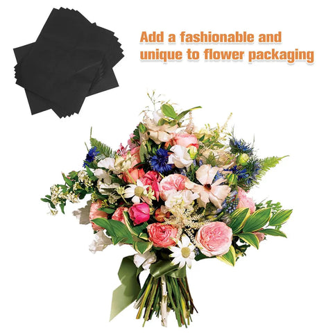 Bouquet wrapped with 10 Piece Floral Embossed Kraft Paper Sheets With Polka Dot Texture For Bouquet Wrapping next to black sheets