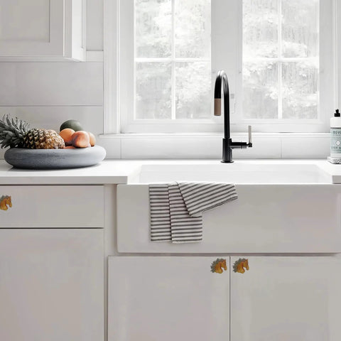 Kitchen with Vintage Western Horsehead Drawer Pulls Set Of 6 Hand Painted Resin Cabinet Knobs on white cabinets under a window.