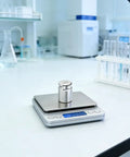 Pro Grade 200 Gram Steel Calibration Weight M1 Class For Scales And Jewelry Balances on a digital scale in a laboratory