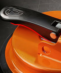 Close-up of Floor Gap Fixer Tool For Laminate, Vinyl, Wood And Tile Floors - Adjustable Quick Lock And Release Repair Tool, Bright Orange