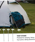 Glow In The Dark Tent Pegs Kit With Hammer And 5M Rope, 10 Steel Stakes For Camping beside tent with backpack on grass