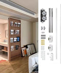 Smooth Trackless Ghost Sliding Door Hardware Kit Soft Close Pocket Door System for wood doors with visible components and installation in a modern home.