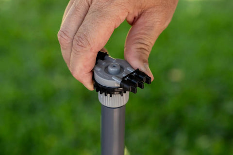 Hand adjusting Six Port Drip Irrigation Manifold With Unregulated Free Flow For Easy Backyard Watering Connects Six Tubes