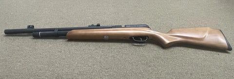 Hard Hitting 25 Cal PCP Air Rifle With 3500 PSI Tank for Serious Power and Precision, shown on tan surface