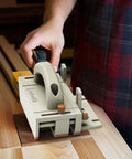 Front view of Zebekk push block, light gray plastic with orange knobs, arch handle for table saws and jointers.