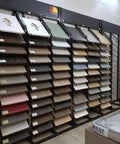 Heavy Duty Floor Tile Display Rack And Sample Organizer Shelf, sturdy iron display holding various tile samples in showroom.