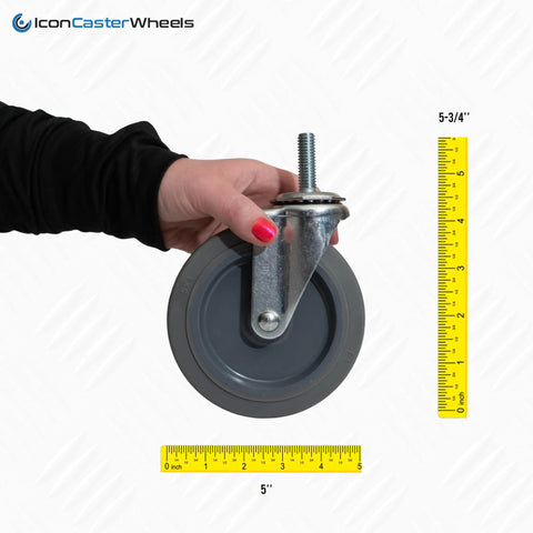 Five Inch Non Marking Rubber Caster Wheels Four Pack With Standard Threading Stem held in hand, showcasing threaded stem and dimension markings.