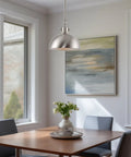 Dining area with Petite Retro Metal Dome Pendant Light in Brushed Nickel Finish over table, modern industrial style.