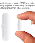 Ten Pieces PTFE Magnetic Stir Bars For Lab Mixers 20 mm White Eight Tenths Inch Stirrers Durable Non Demagnetizing Magnetic Stir Sticks Great For Scientific Experiments, white PTFE stir bar shown between fingers
