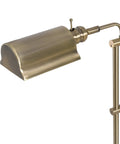Antique Brass Floor Lamp With Adjustable Height And Swivel Head, Classic Mid Century Modern Vibe, 50 Inch Tall, narrow base close-up.