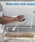 Person washing dishes in a sink with a Stainless Steel Sink Splash Guard Wall Mount With Screws 17 By 12 Inch Heavy Duty Rustproof Corner Guard visible.