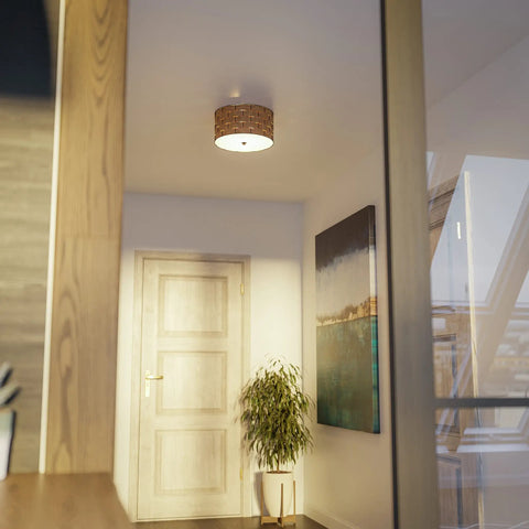 Shaker 3 Light Flush Mount Fixture In Brown Finish with blackened bronze frame and woven wood detailing in hallway.