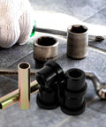 Golf Cart Suspension Bushing Kit Replacement With Rubber And Metal Leaf Spring Bushings For Front And Rear on stone surface