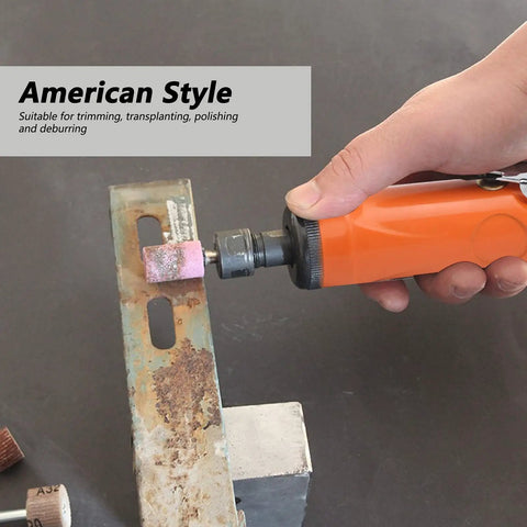 Hand holding Straight Pneumatic Air Die Grinder Kit With Quarter Inch Collet Japanese Style Ergonomic Grip And Ten Piece Abrasive Stone Bits.