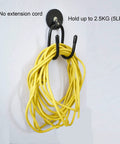Magnetic Power Drill Tool Organizer Holder With Heavy Duty 2 Inch Opening Sweet For Garage Storage Magnetic Tool Holder Rack Rubber Covered Industrial Magnet Holds Up To 5 Pounds No Tools Needed Easy Mount holding yellow extension cord on wall.