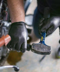 Top Tier Heavy Duty Black Nitrile Gloves 8 Mil Thick Build Real Deal Industrial Grip engineered for a mechanic using a hammer.