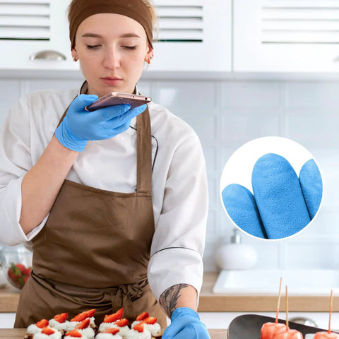 Person wearing Blue Nitrile Exam Gloves Disposable Latex Free Non Sterile Medical And Food Safe Powder Free 100 Count Box Medium Size