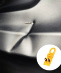 Professional Grade Paintless Dent Removal Kit featuring sturdy pullers on a dented car bumper surface.