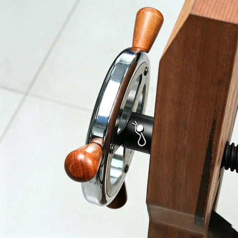 Close-up of the handwheel from a Heavy Duty Woodworking Leg Vise Kit With Inertia Driven Handwheel For Quick Open Close Strong Parallel X Bracket Adjustable Workbench Clamp For Carpentry Furniture Making And DIY Workshop Projects.