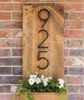 5 Inch Floating Stainless Steel Address Sign With Nail Kit For Outdoors Black Sign mounted on wooden board with flowers
