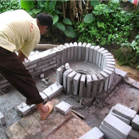 Person constructing a circular stone foundation for High Efficiency Axial Flow Hydro Generator 8KW 10KW 12KW Single Phase 230V
