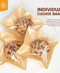 Three cookies in 100 Pack Heat Sealable Cookie Bags With Window Grease Resistant Grab And Go Bakery Bags For Treats Donuts Cookies Brownies Cakes Scones Great For Bake Sales