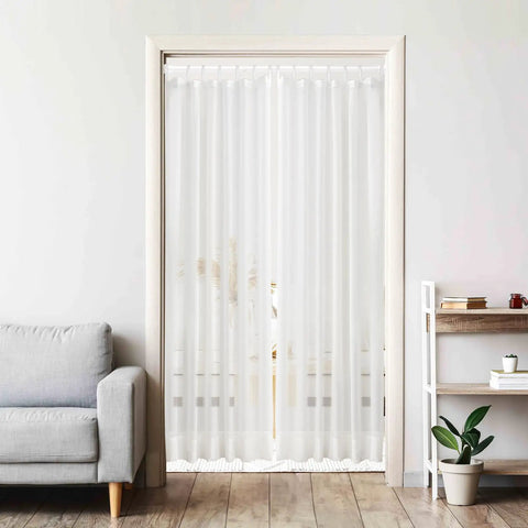 Pair Of Adjustable White Spring Tension Curtain Rods 28 To 48 Inches No Drill No Tools Easy Install Non Slip For Windows Doors Bathrooms And Doorways Anywhere holding sheer curtains in a light-filled room doorway.