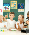 Science Classroom Decoration Banner And Poster Set For Teachers on lab wall with kids and science equipment, motivational designs visible.