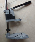 Versatile Drill Stand And Press Converter For Portable Drills, heavy-duty steel mount with lever for stable drilling tasks.