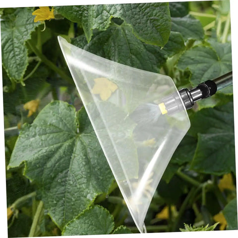 Drift Guard Spray Nozzle With Windproof Shield for Backpack Sprayers in action in agricultural setting.