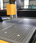 4 Axis CNC Router Machine For Wood And Soft Metal with rotary axis, close-up of work surface and spindle in workshop