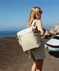 Woman wearing Madeleine Midi Backpack Soft Cooler That Holds 20 Cans, Keeps Drinks Cold All Day, Insulated Travel Backpack With Zipper, 14.8 Quarts.