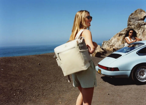 Woman wearing Madeleine Midi Backpack Soft Cooler That Holds 20 Cans, Keeps Drinks Cold All Day, Insulated Travel Backpack With Zipper, 14.8 Quarts.